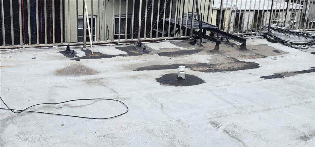 Roof and parapet waterproofing detail work during a roof leak repair by Tekno Construction in New York