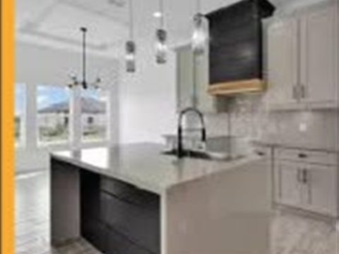 Modern kitchen renovation with island by Tekno Construction